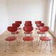 Set of 9 vintage retro chairs in red faux leather.