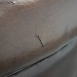 Stylish and sturdy dark brown club armchair made of sheepskin leather