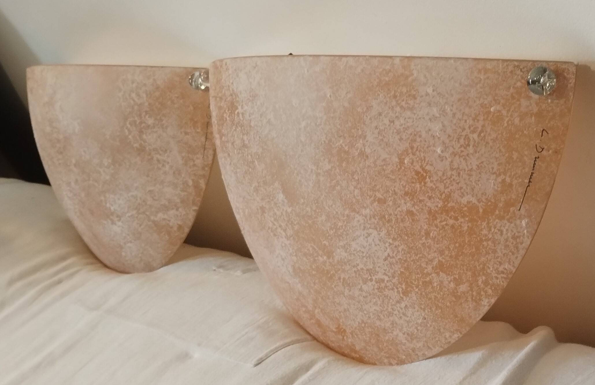 Pair of wall sconces signed L. Drummer