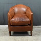 Solange club armchair in sheepskin leather.