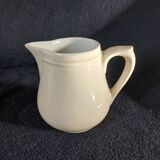 Old milk jug in steel clay