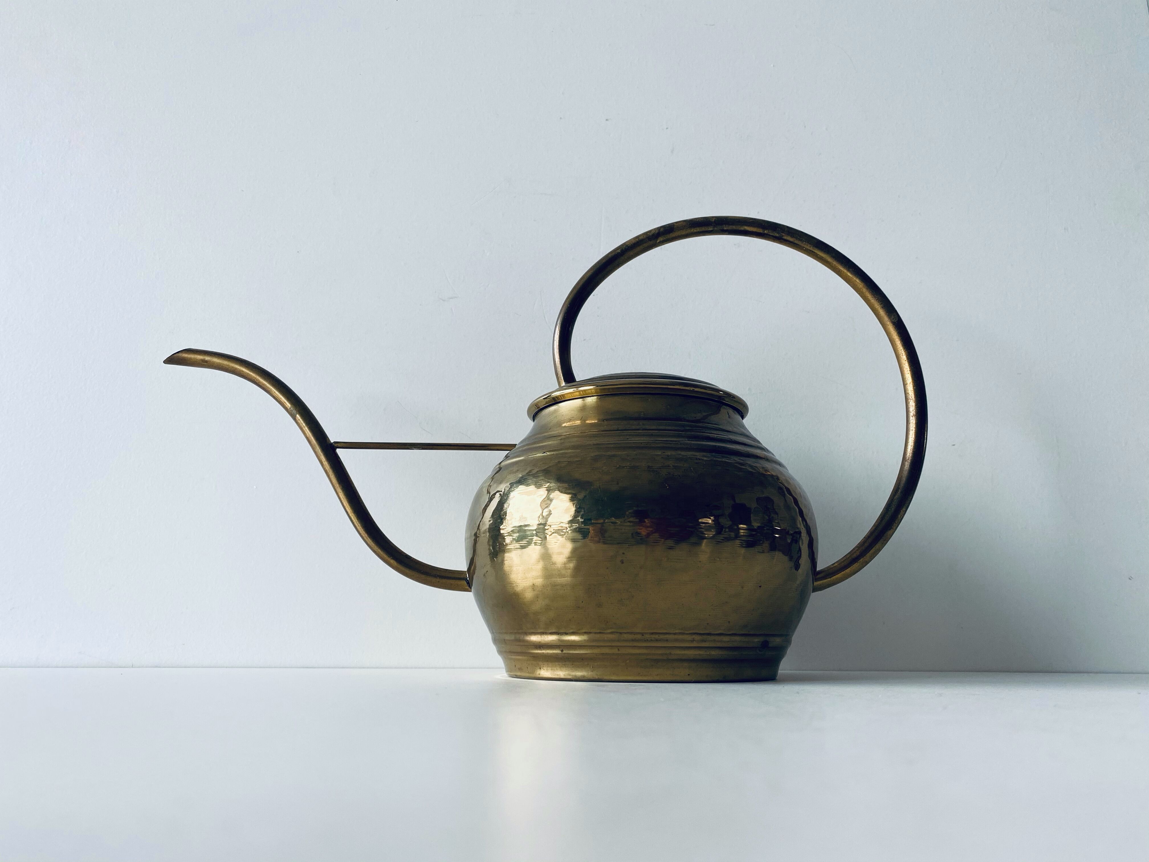 Old brass watering can