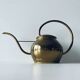 Old brass watering can