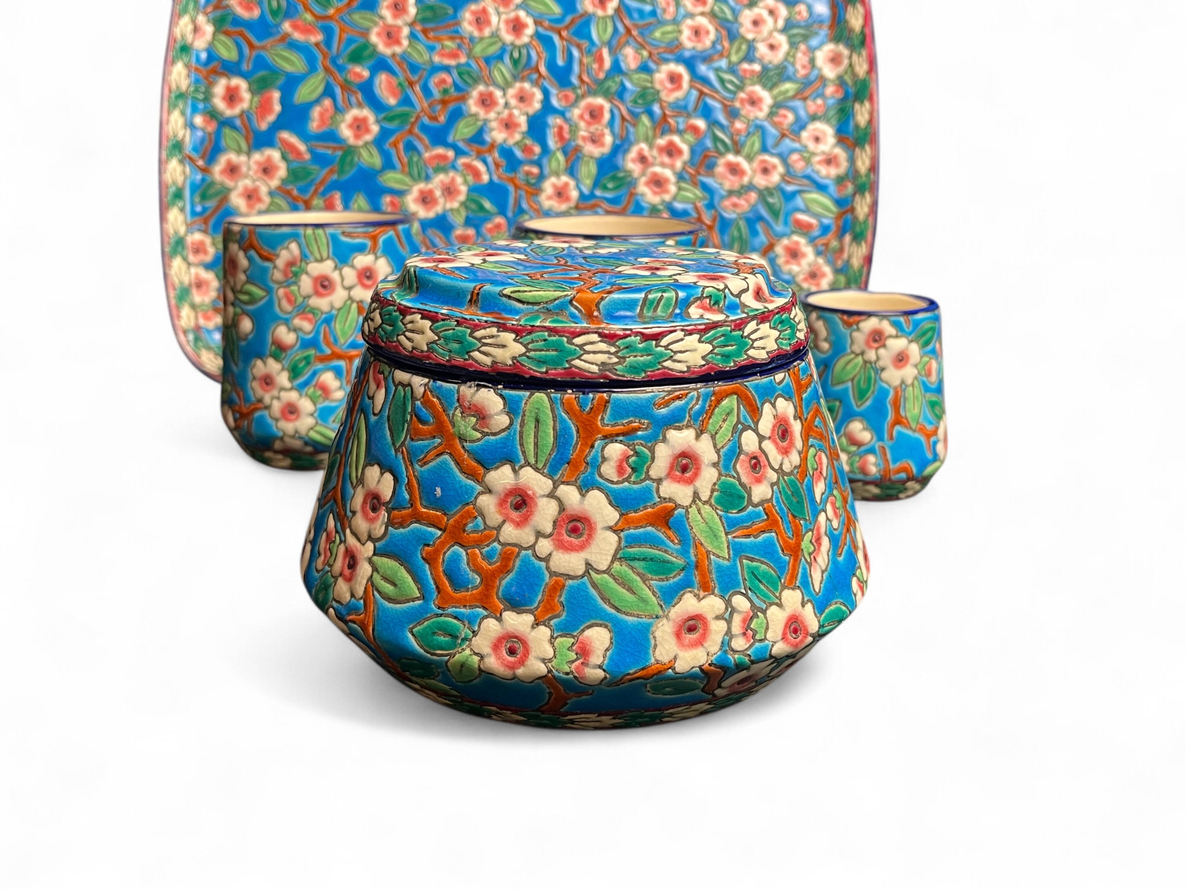 Longwy, cherry blossom glazed earthenware smoking set, early 20th century