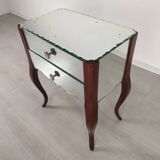 Glass art deco mirror beside table