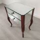 Glass art deco mirror beside table