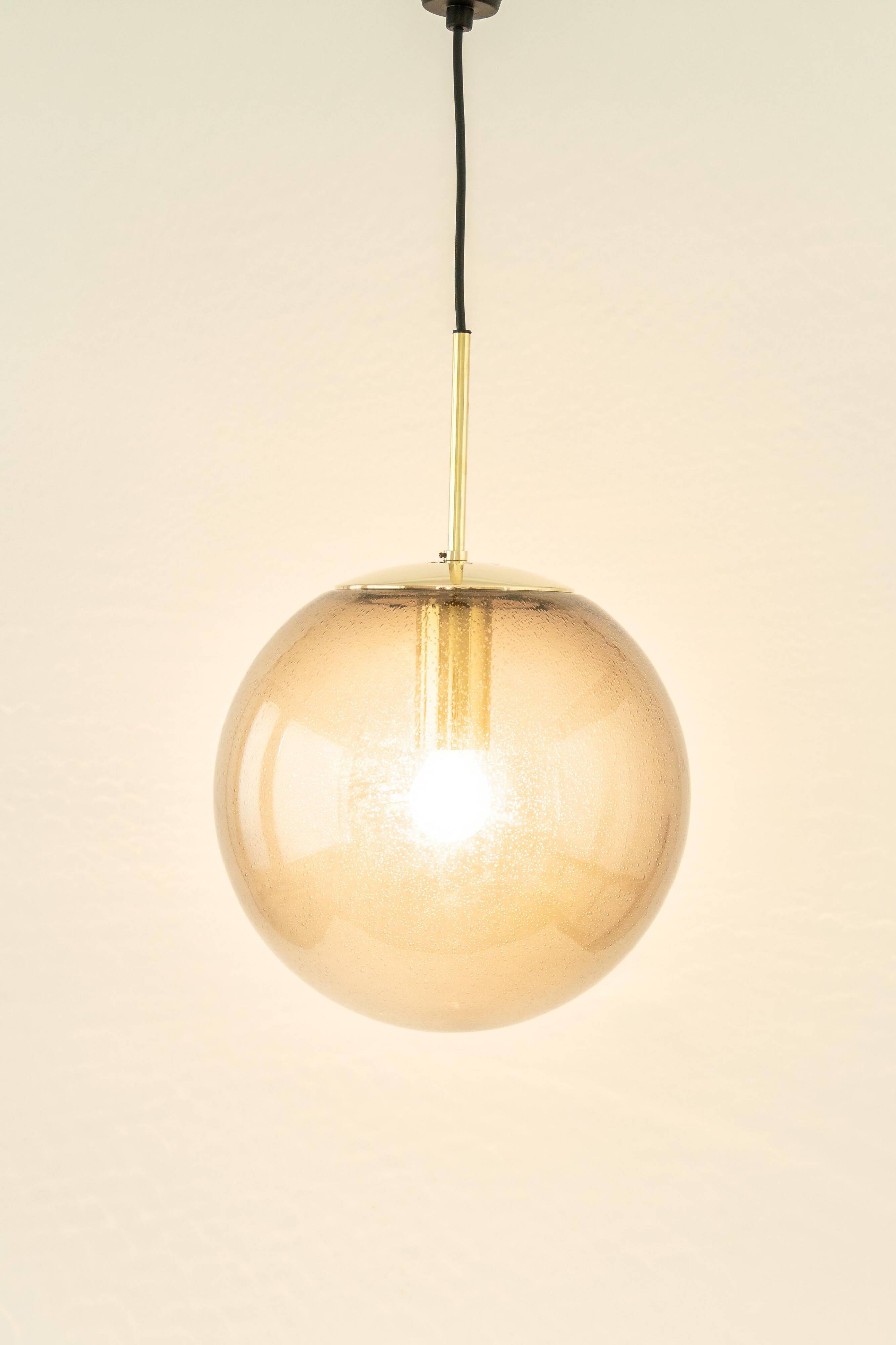 Smoked glass and brass ball pendant light Limburg, Germany, 1970s