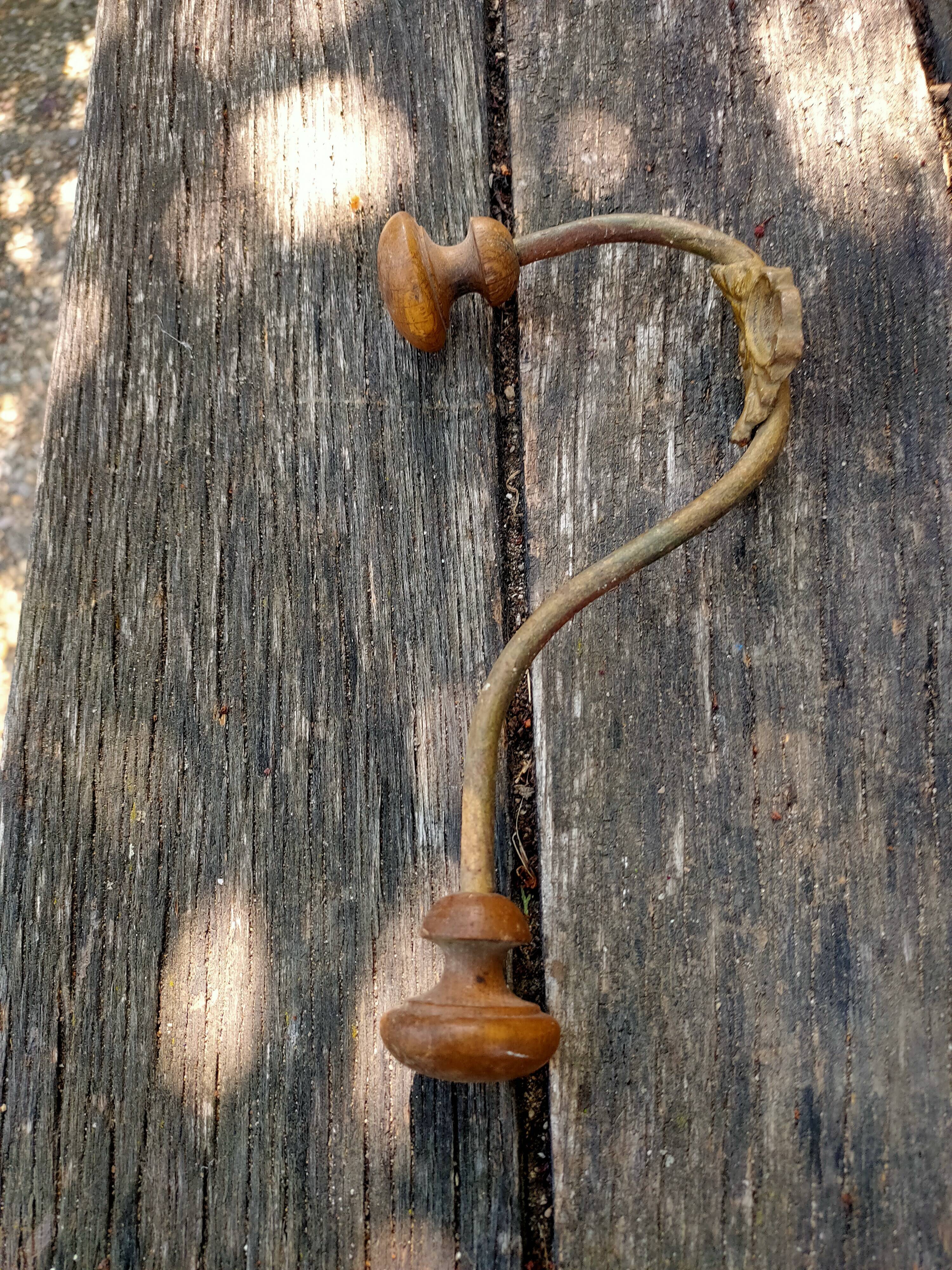 Wooden and metal wall coat rack.