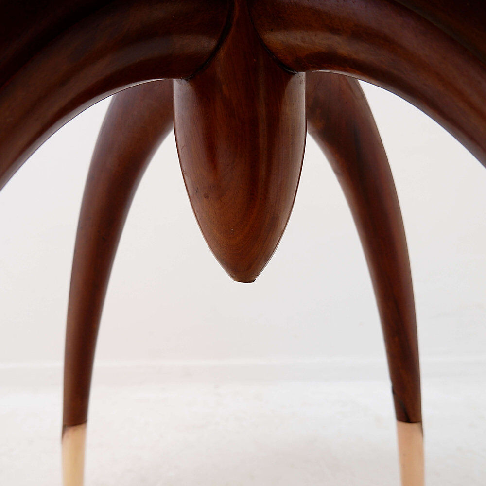 Round Art Deco side table in wood with curved legs and brass feet.