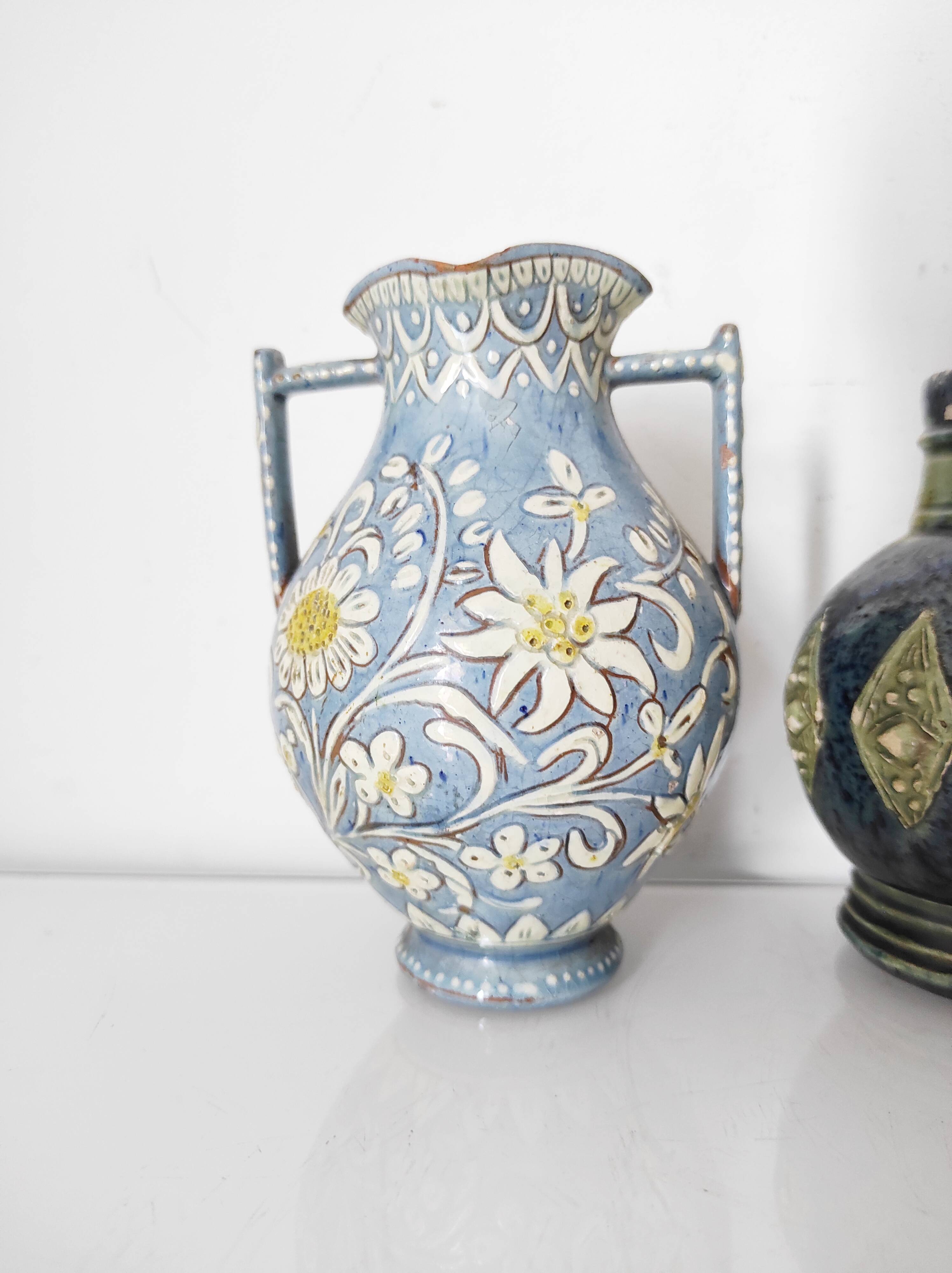 Two small blue ceramic vases
