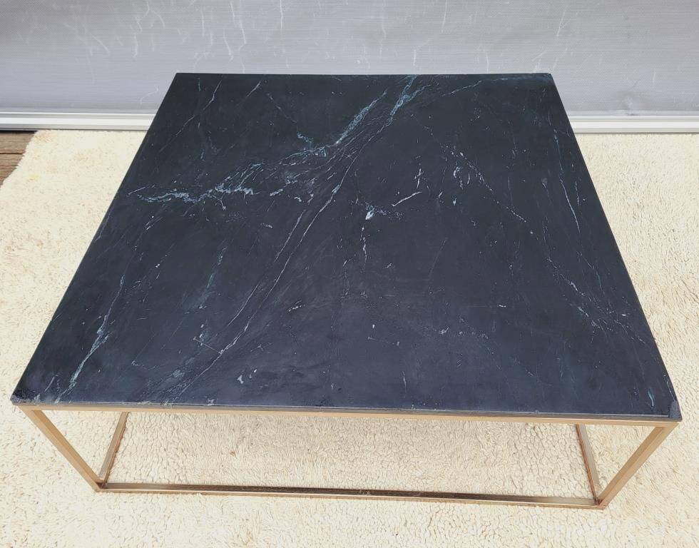 Coffee table or black marble and brass display "in its own juice"