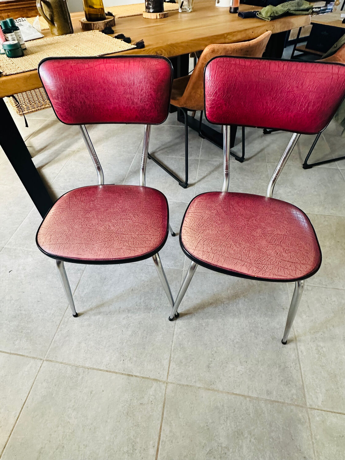Pair of raspberry-colored chairs from the 60s/70s with metal legs