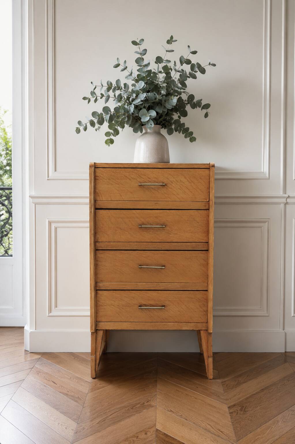 Vintage chest of drawers in raw wood.