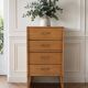 Vintage chest of drawers in raw wood.