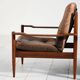 Scandinavian teak and leather lounge set with two armchairs and ottoman