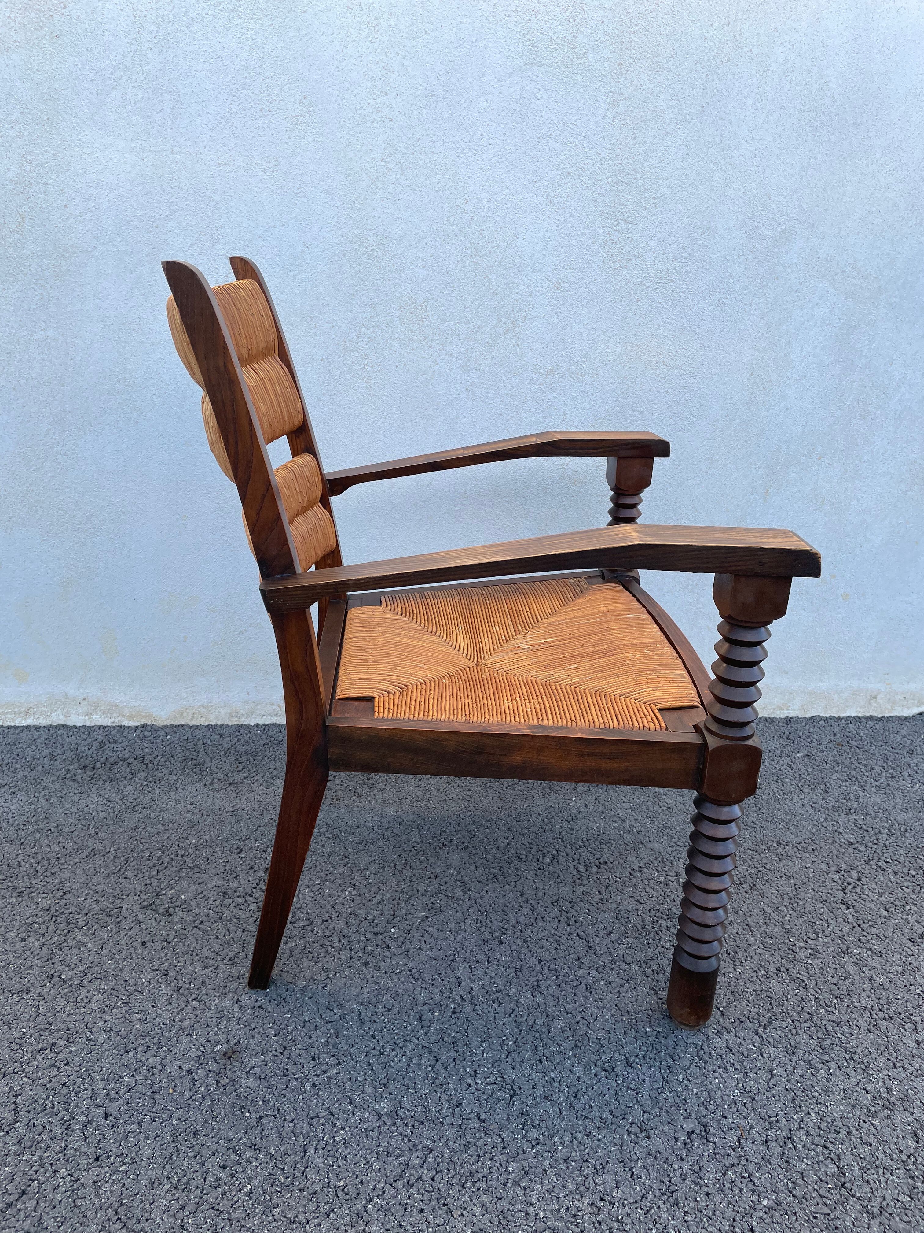 Vintage armchair in straw and brutalist wood