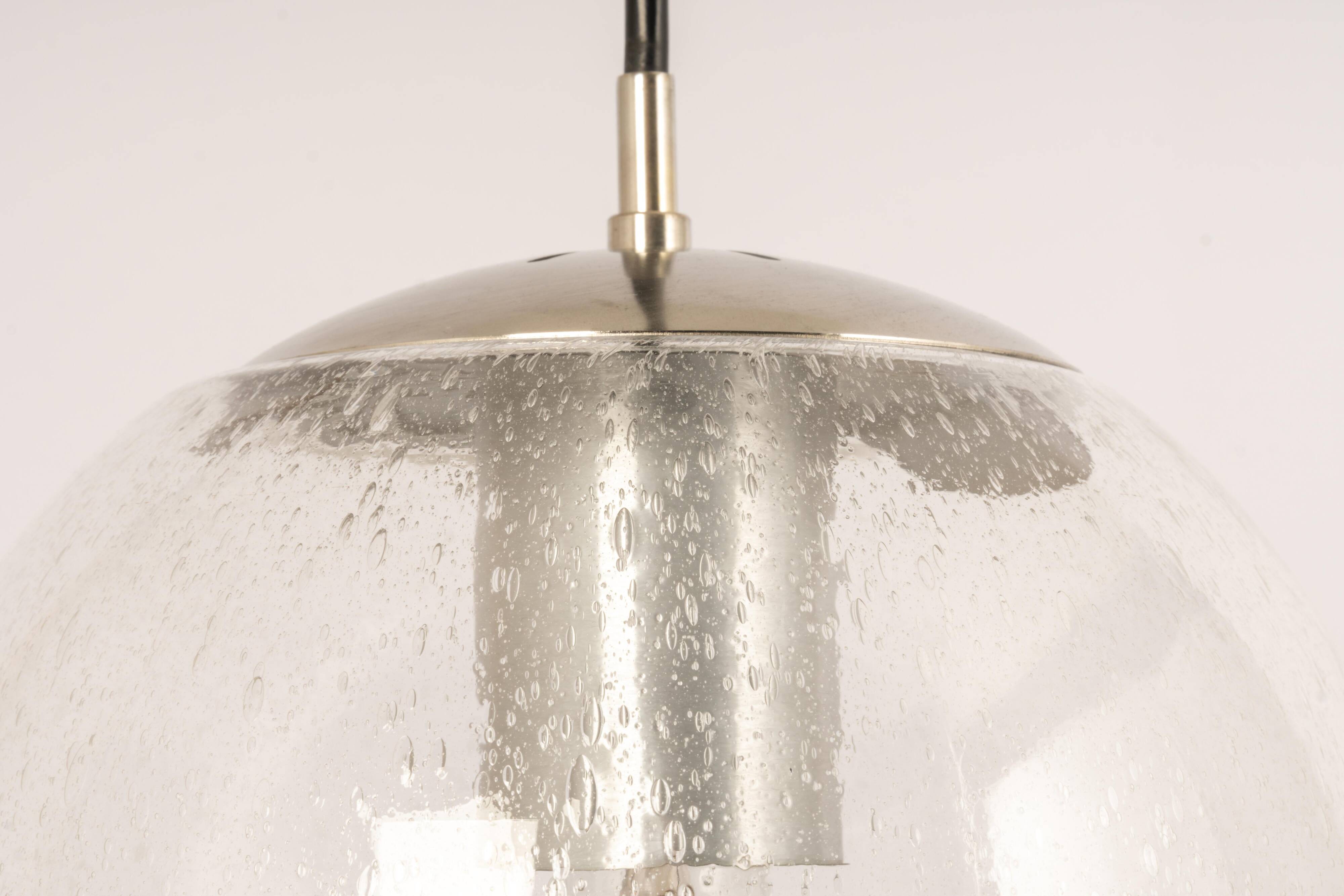 Small Limburg chrome pendant light with transparent glass ball, Germany, 1970s.