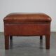 Leather ottoman in classic English style finished with decorative nails