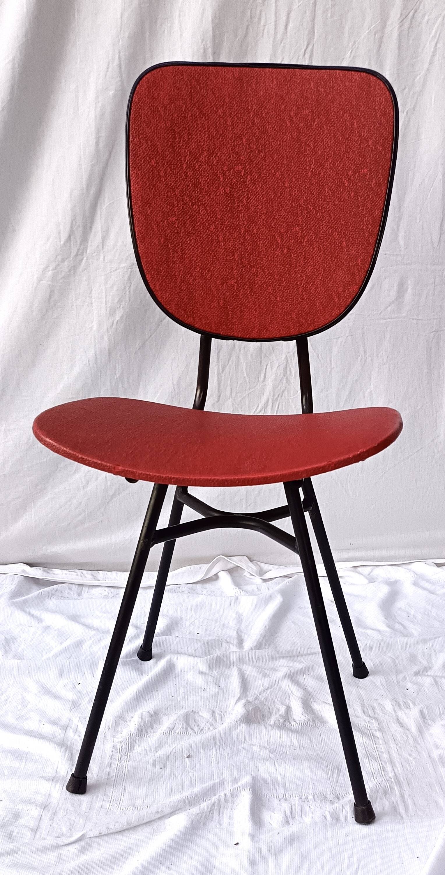 sixties chair with steel tube legs and a skaï seat