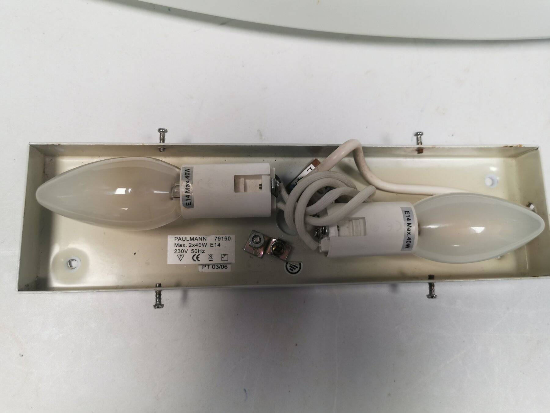 Wall lamp from Paulmann with white opal glass shade.