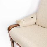 Armchair in rosewood and upholstered with light fabric, of Danish design, 1960s