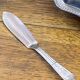 Shell-shaped butter dish in stainless steel and blue glass