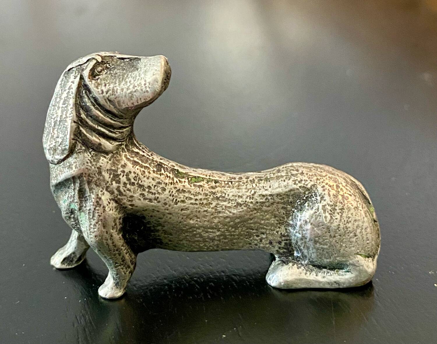12 old dog-shaped Etains du Manoir knife holders
