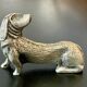 12 old dog-shaped Etains du Manoir knife holders