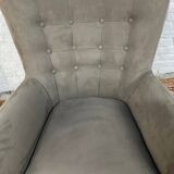 Swivel armchair in velvet fabric and metal