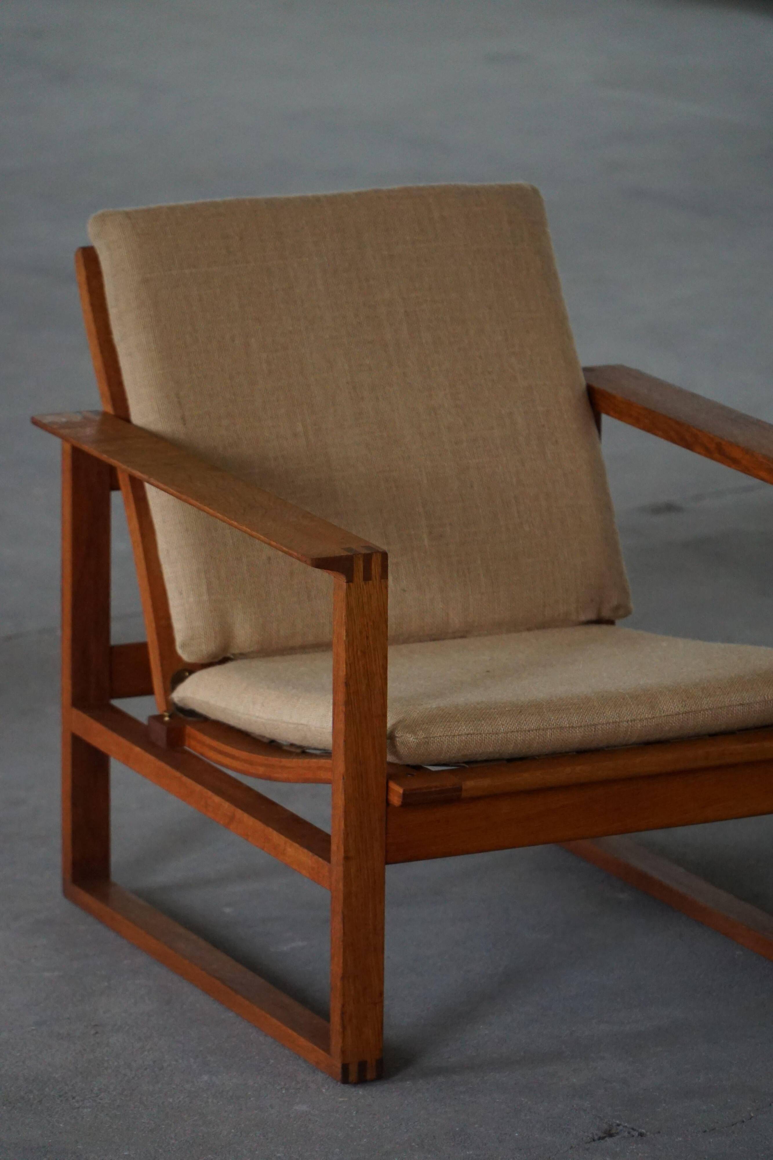 Børge Mogensen, a pair of BM2256 lounge chairs in oak and jute, Denmark, 1960s.