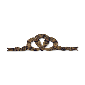 Carved and open wooden pediment - knot