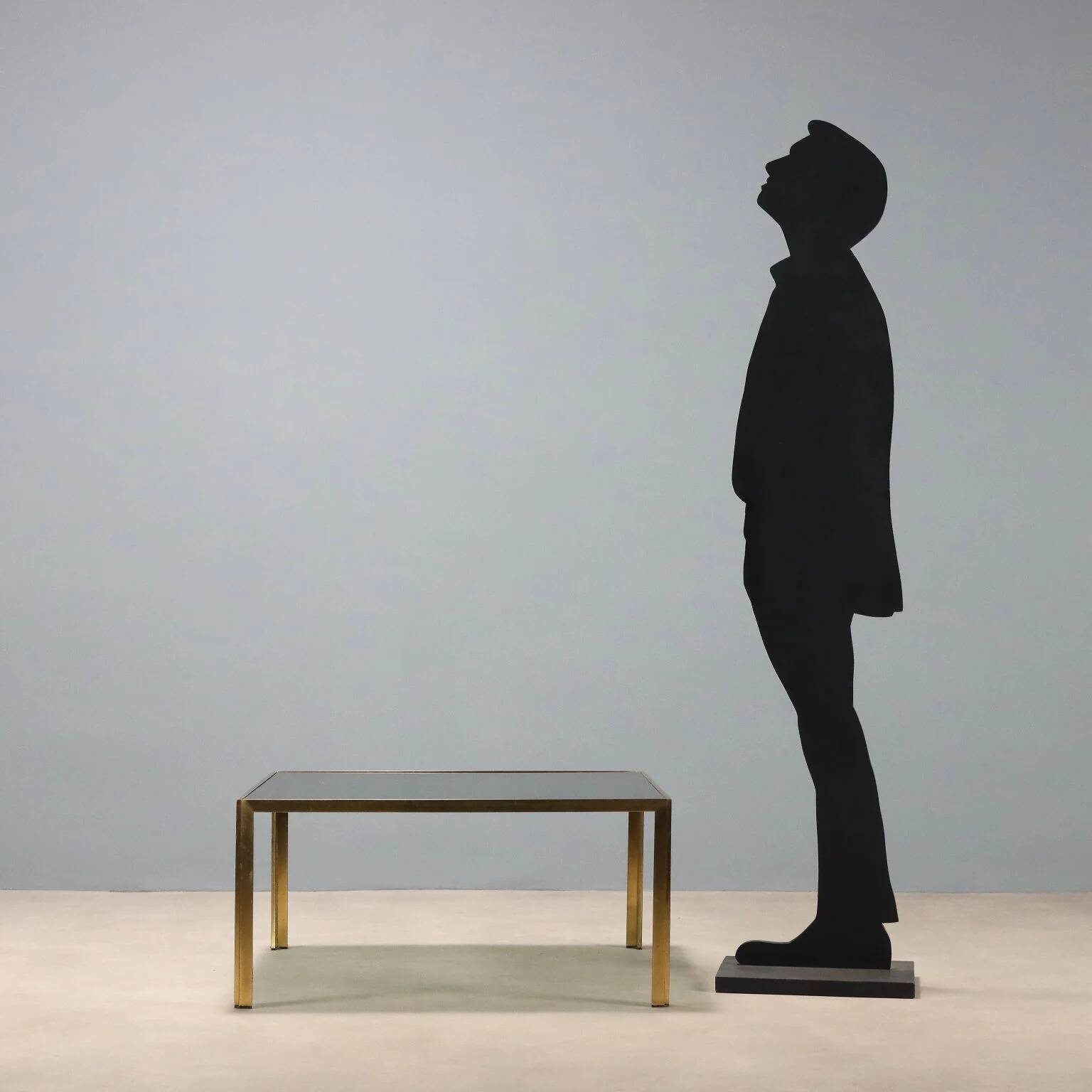 Vintage coffee table in brass and smoked glass, 1970s design.
