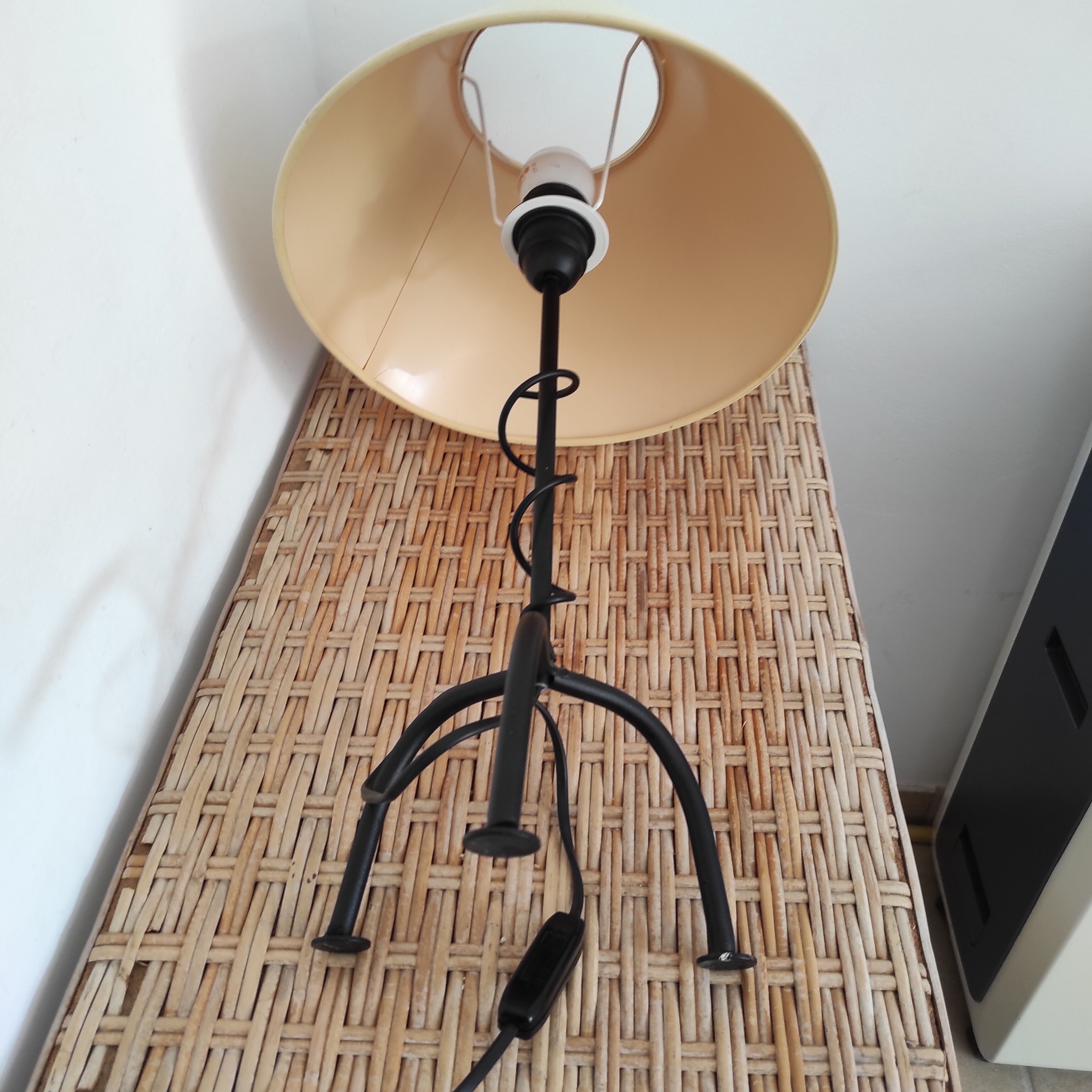 Black wrought iron table lamp and beige lampshade