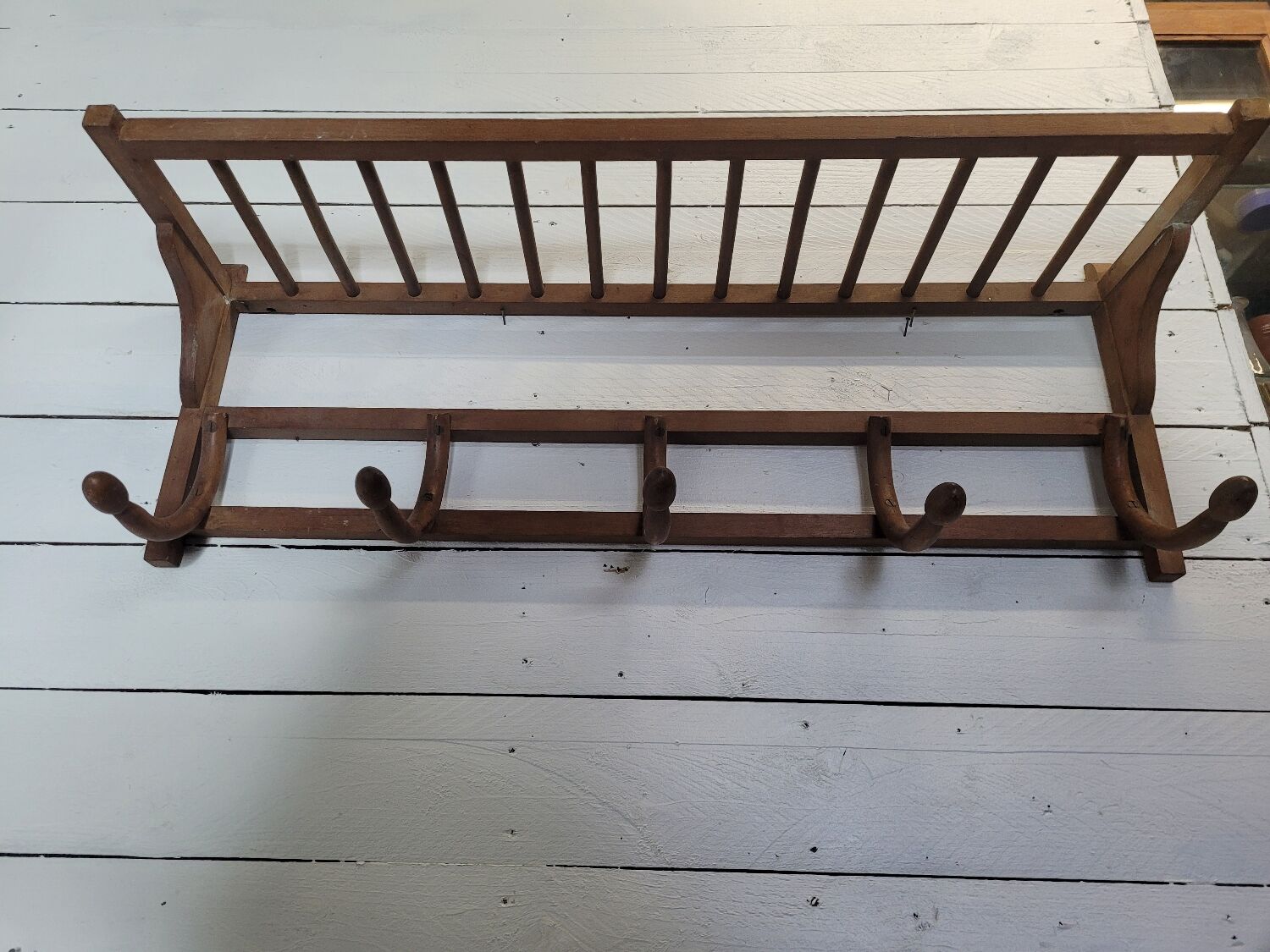 Curved wooden coat rack