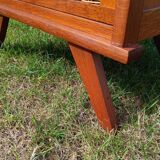 Tall chest of drawers in wood and rattan with splayed legs