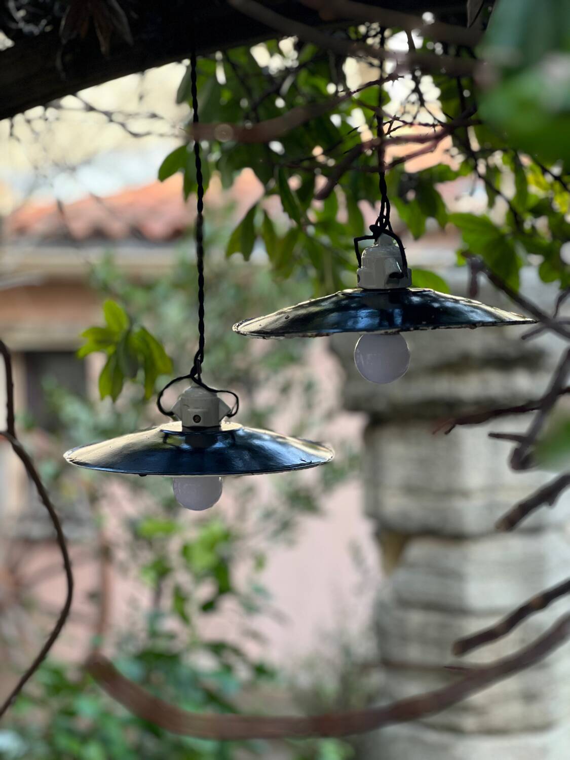 Pair of black and white sheet metal pendant lights, ceramic sockets