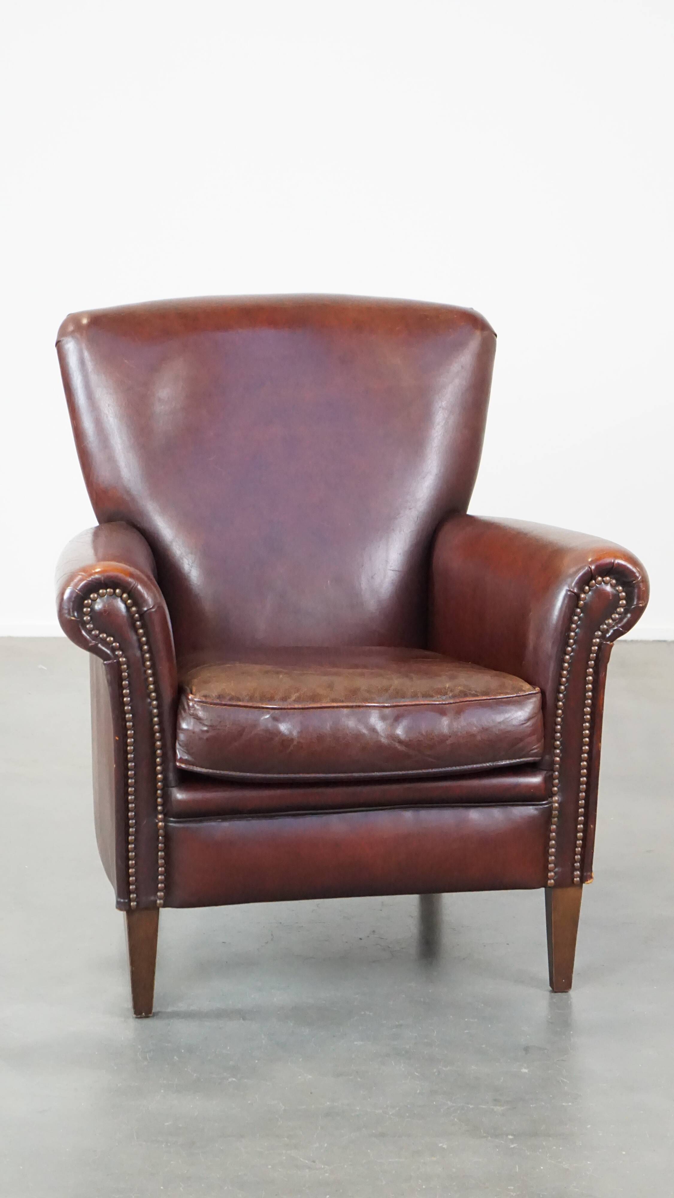 Sheep leather armchair correctly finished with decorative nails