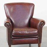 Sheep leather armchair correctly finished with decorative nails