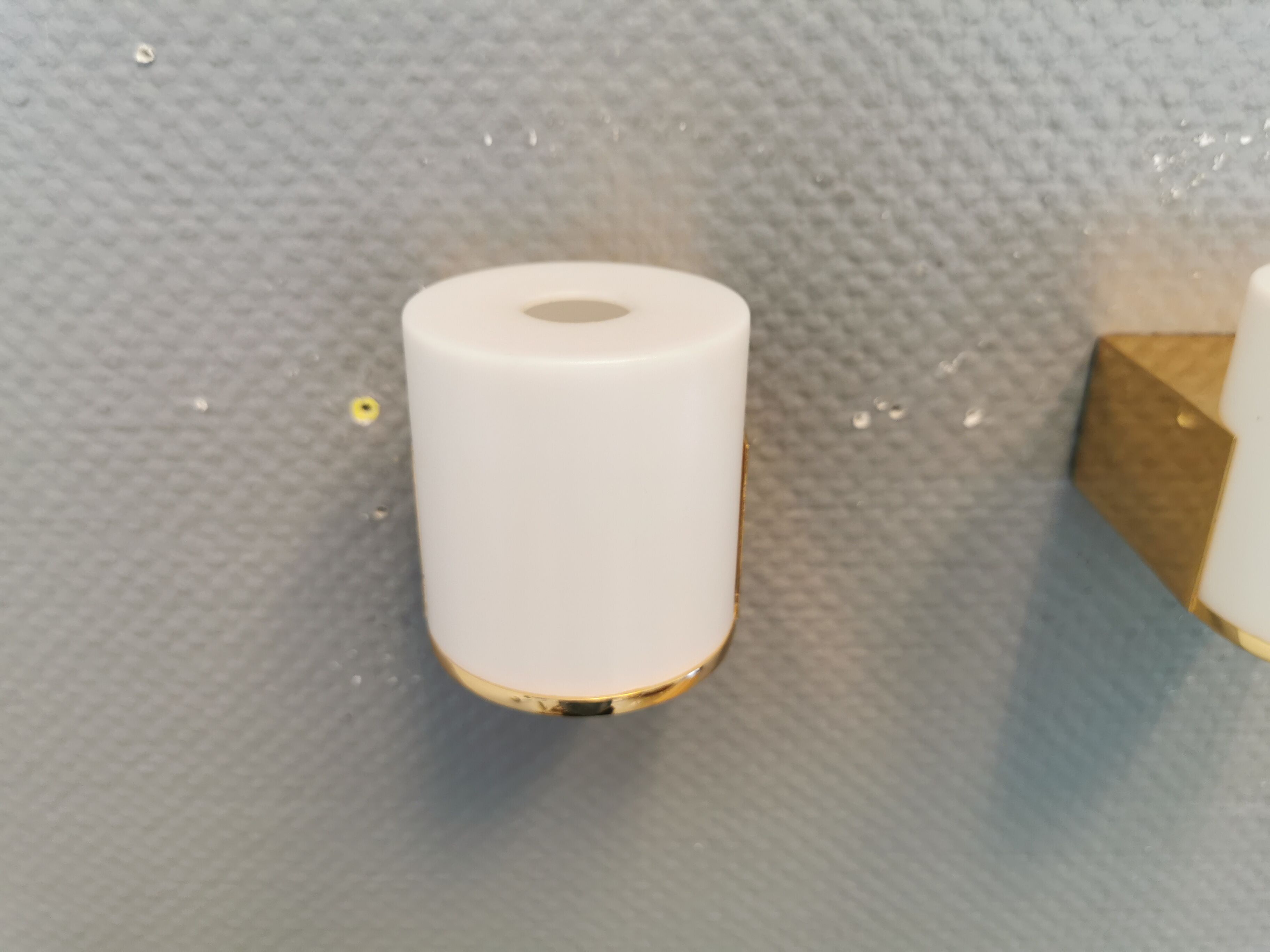 Wall lamps with milky white acrylic plastic shades and solid brass bases