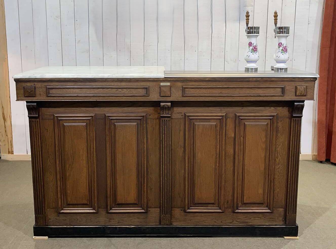 Bar counter in oak, zinc, and white marble from the early 20th century.