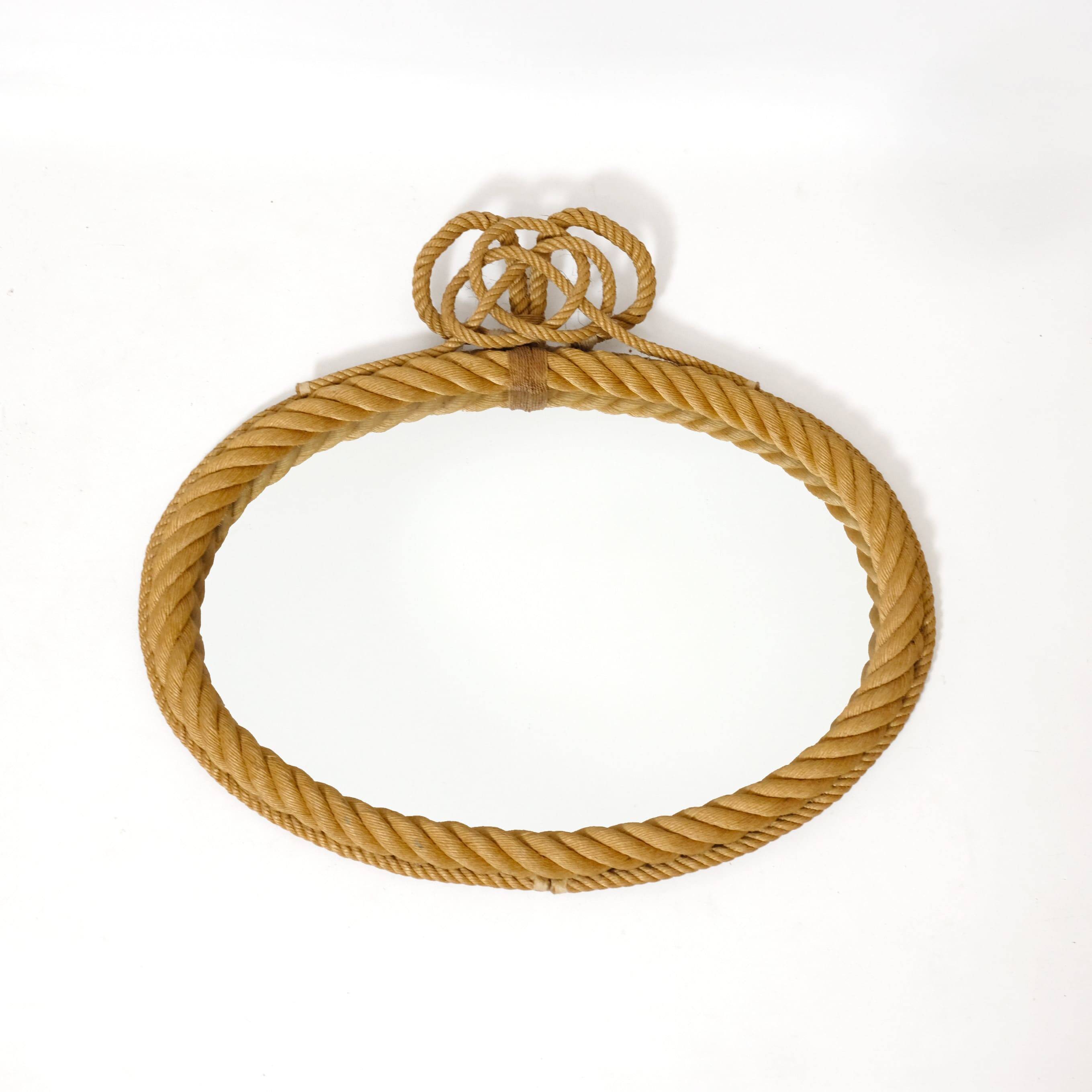 Large oval mirror in rope with pediment, 64cm x 56.5cm.