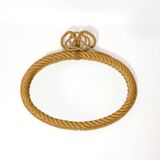 Large oval mirror in rope with pediment, 64cm x 56.5cm.