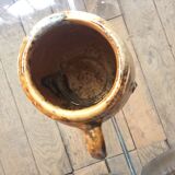 Veneered earth jug