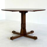 Wooden round dining table from ISA Bergamo with unique base