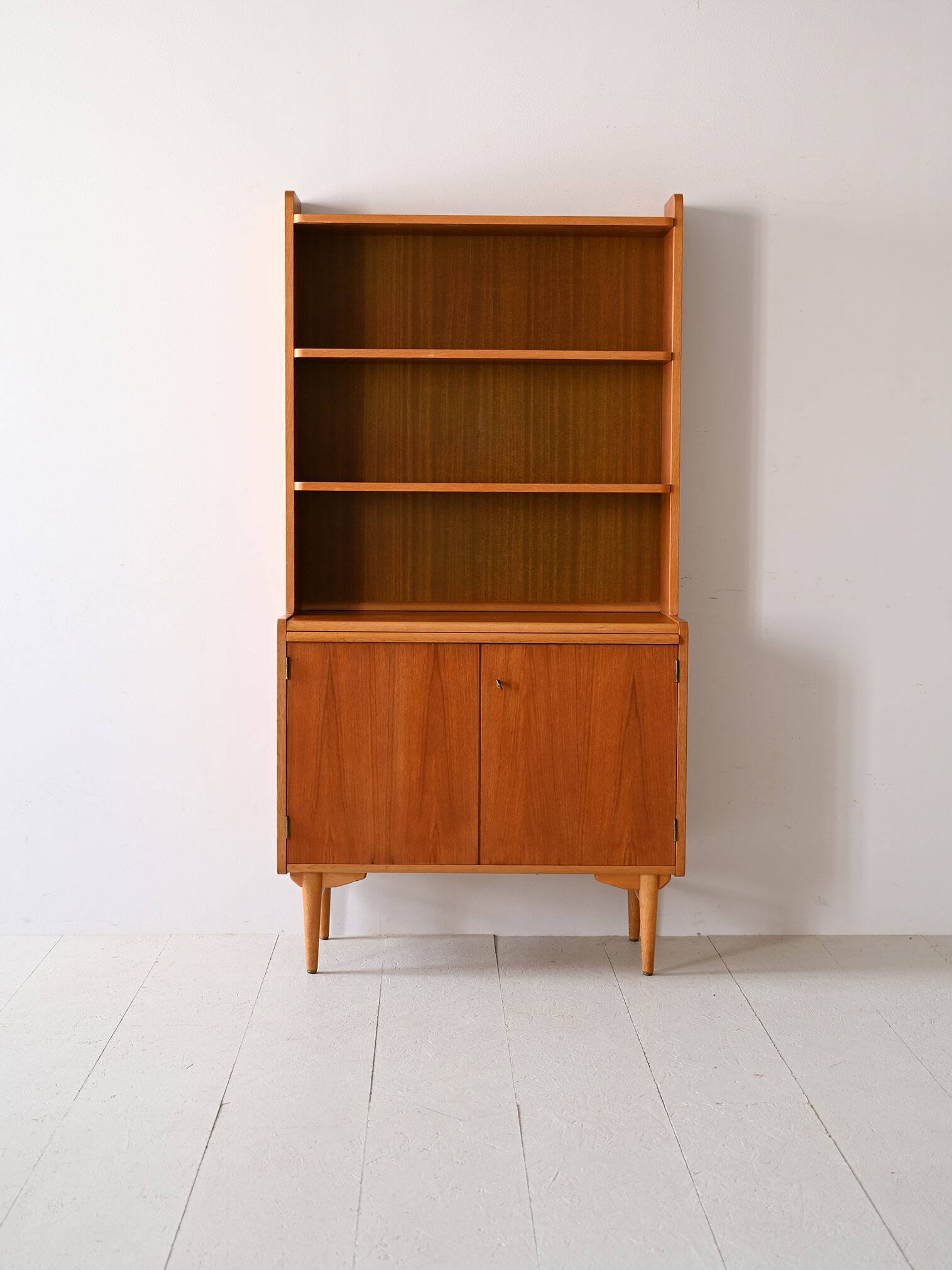 Vintage bookcase with pull-out shelf