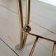 Table basse vintage en bois laqué et métal doré