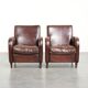 Dark cognac-coloured set of 2 sheepskin armchairs with a sleek design