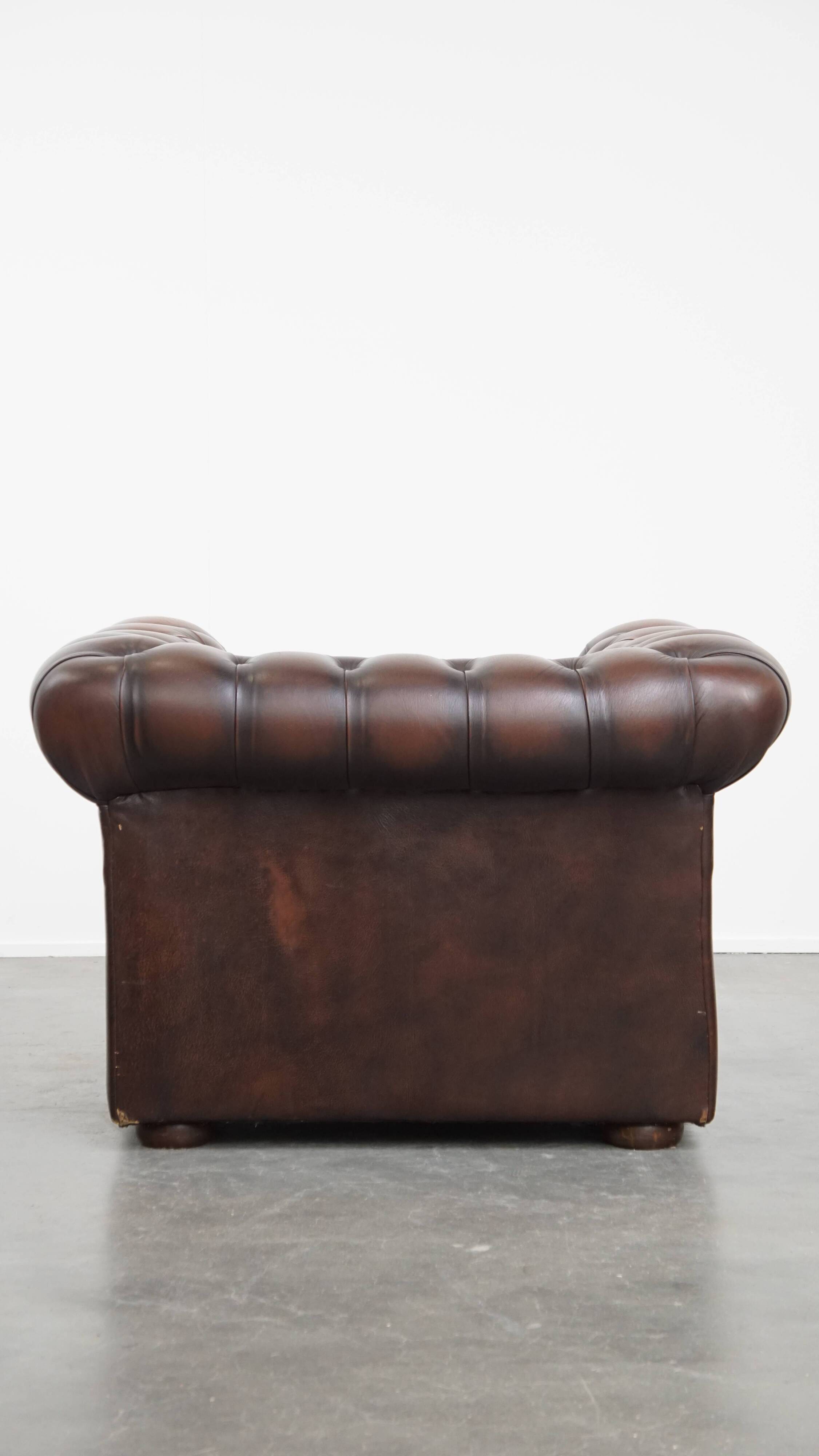 Dark brown English cowhide leather chesterfield armchair