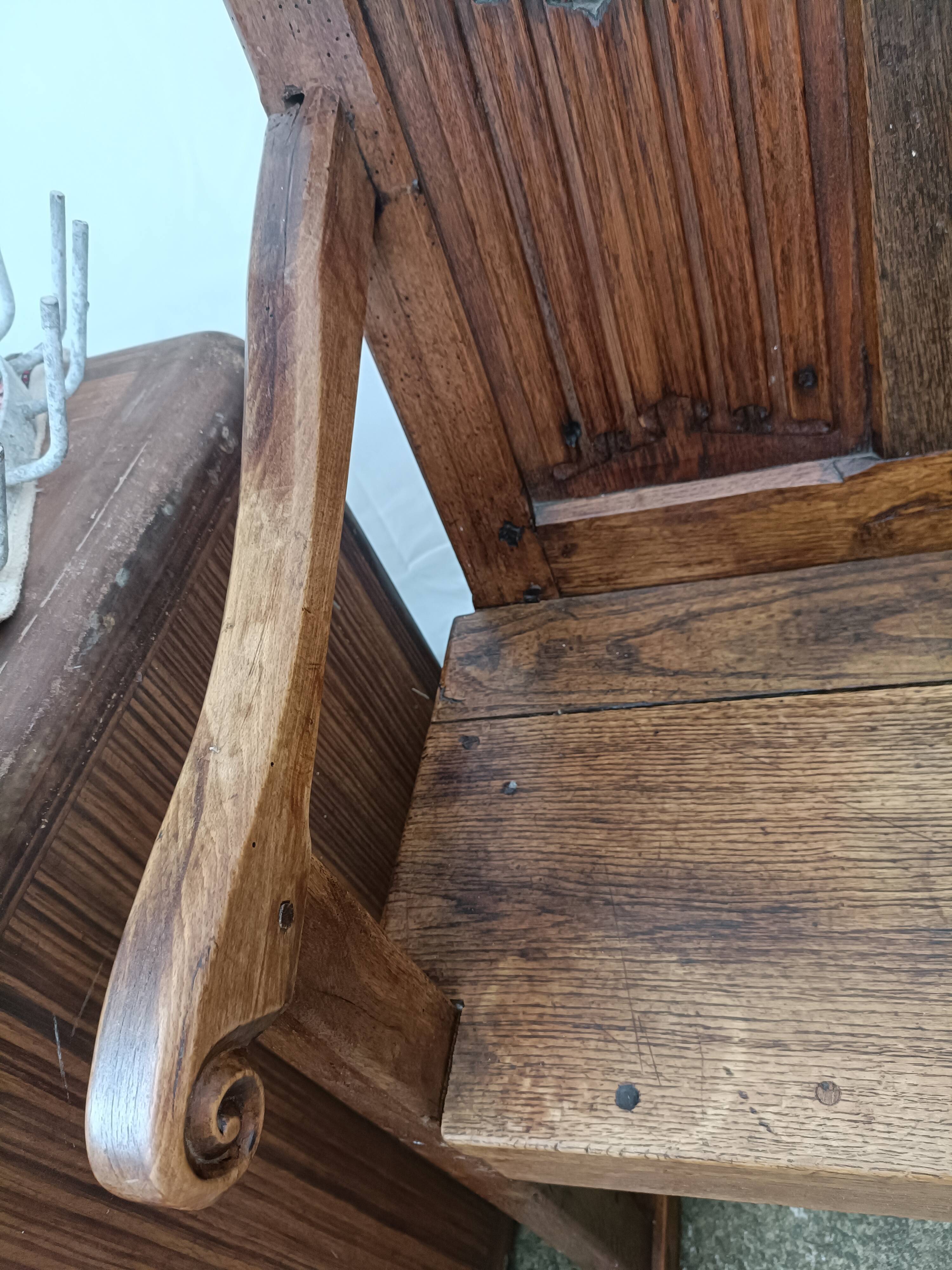 Oak church bench period XVII th century, back decorated with carved parchments