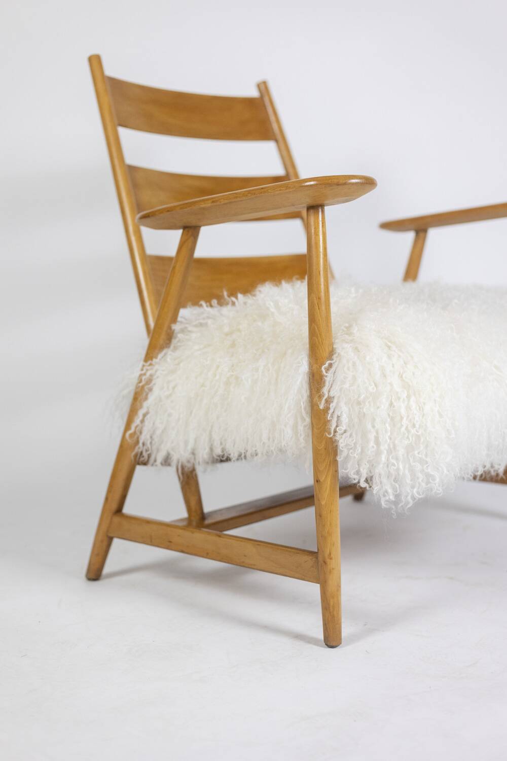 Pair of “lounge” armchairs in blond beech. 1950s